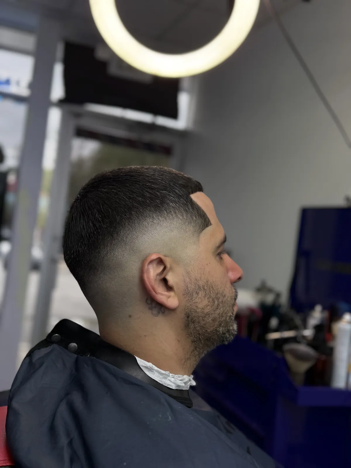 Clean taper fade with sharp part line