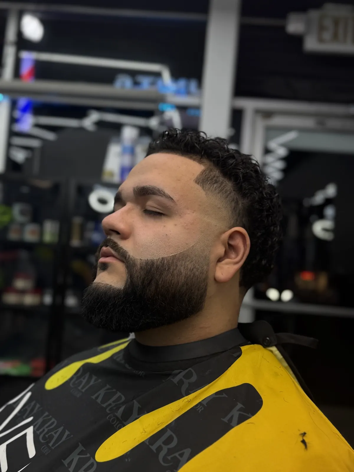 Sharp skin fade with sculpted full beard