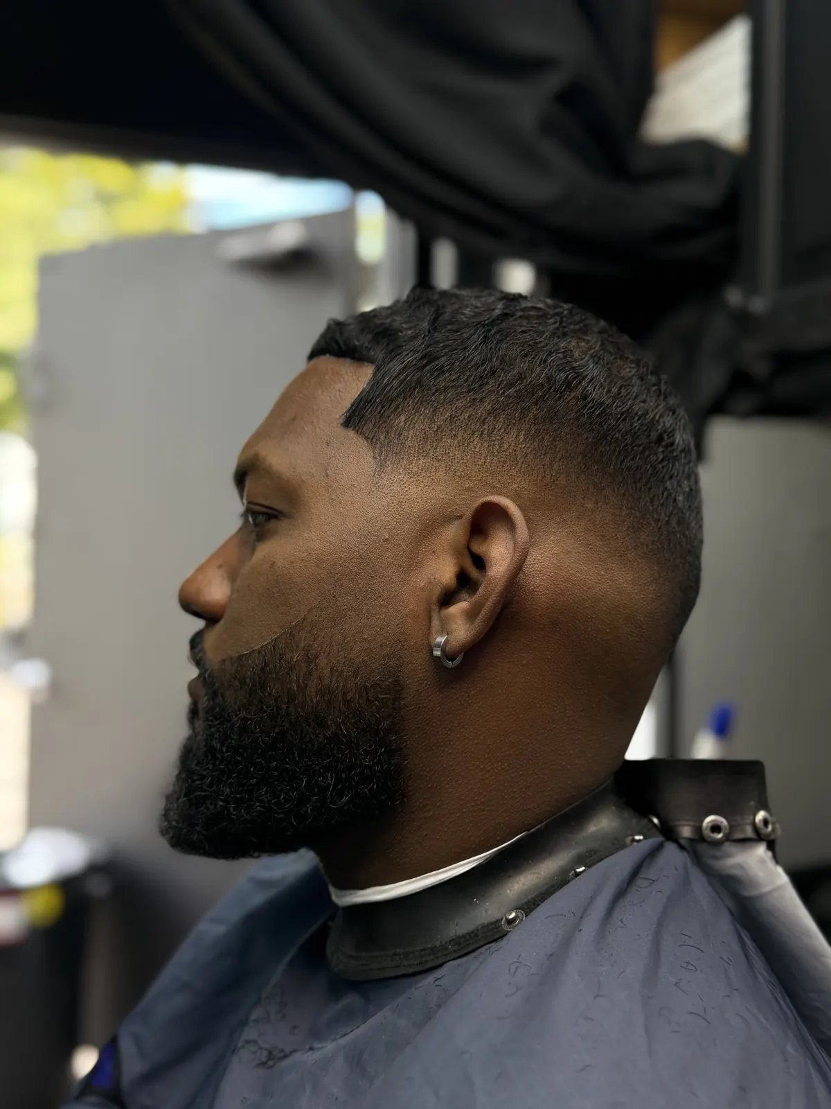 Full beard sculpt with clean fade